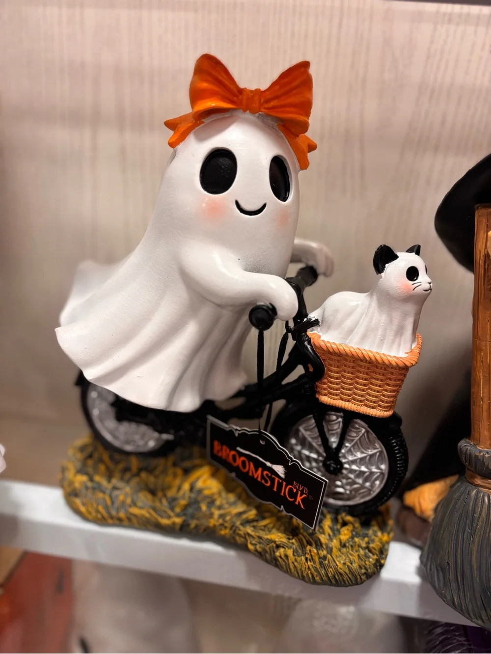 Viral Ghost with orange bow riding a bicycle with Cat in basket Figurine